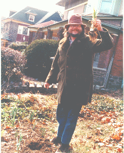Dr. LaFollette taking a leek in the garden.